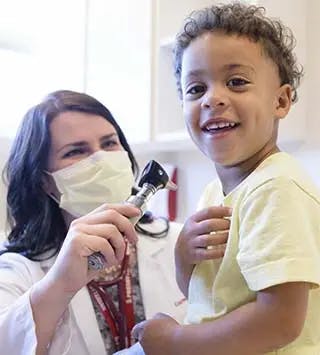 Doctor and smiling child