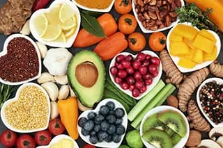 A table spread of fruits, vegetables, and more.