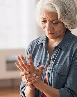 Person massages their hand